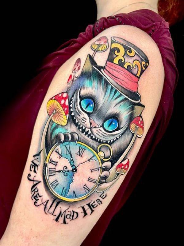 This tattoo is a and playful depiction of the Cheshire Cat, complete with a top hat and a large, detailed pocket watch.