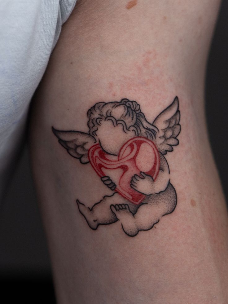 Cherub Holding Red Heart Tattoo Design
