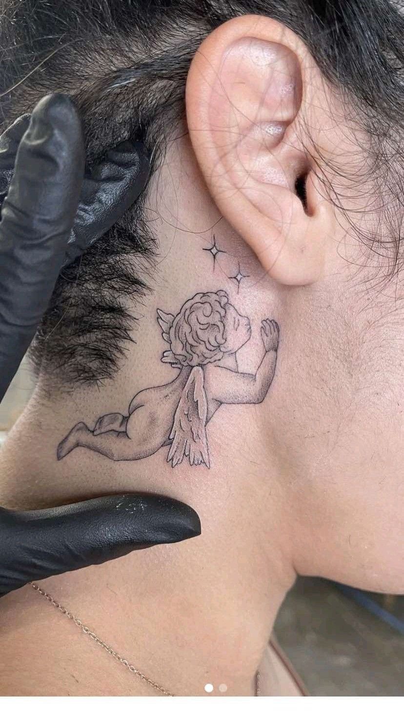 Tiny Neck Cherub Whisper Tattoo Design