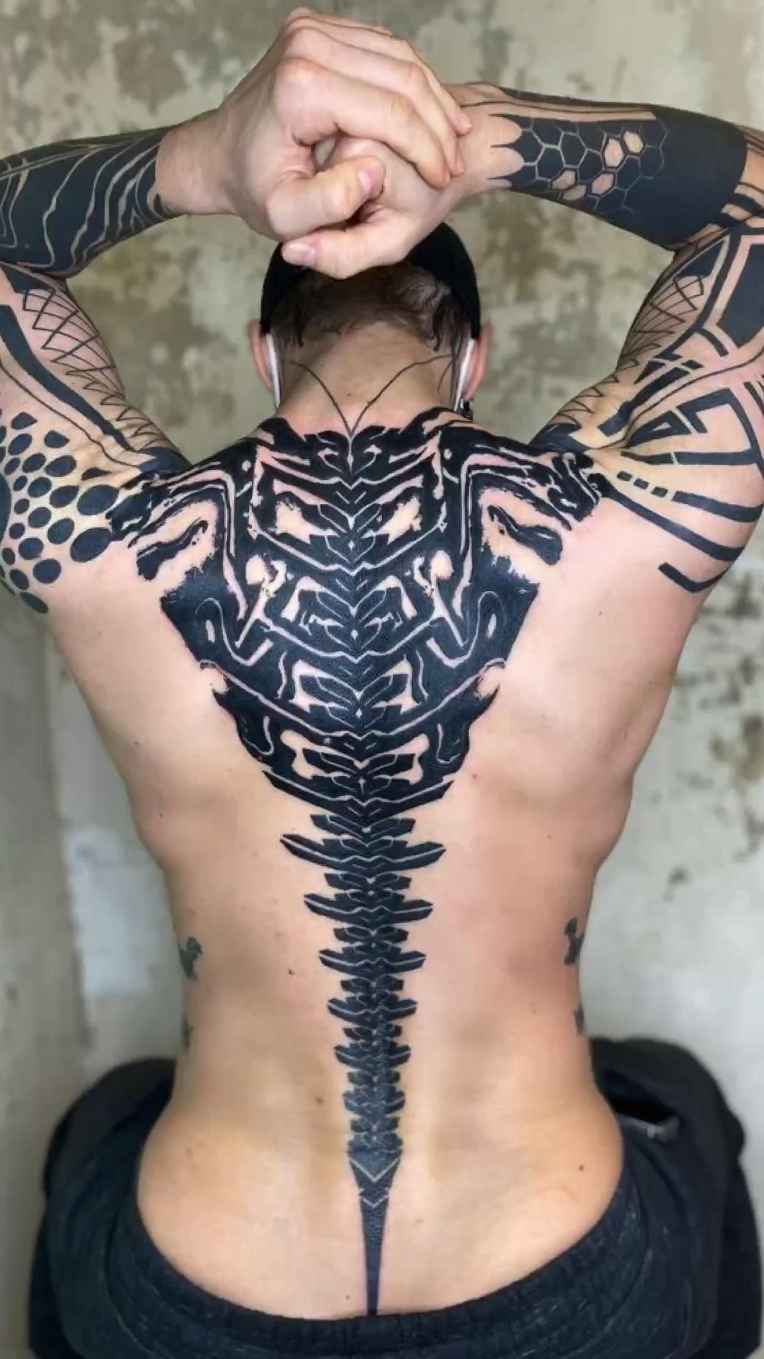 Abstract Tech Spine in Bold Blackwork Tattoo Design