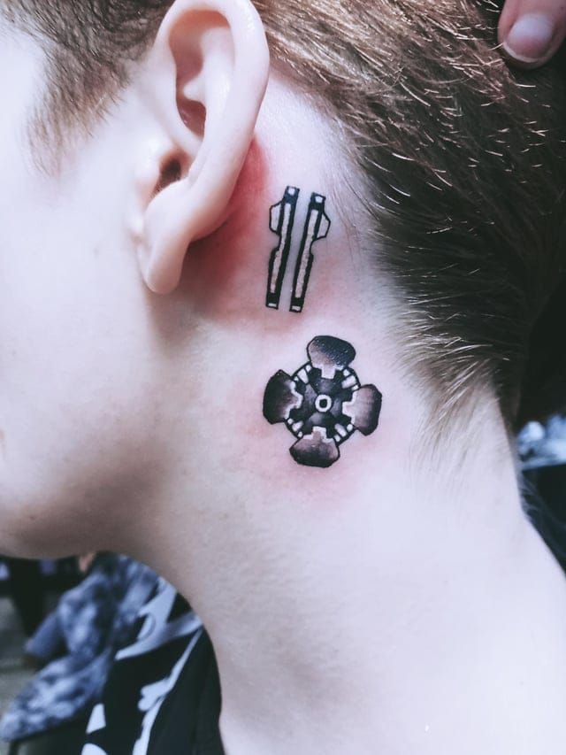Microtech Symbol Behind the Ear Tattoo Design