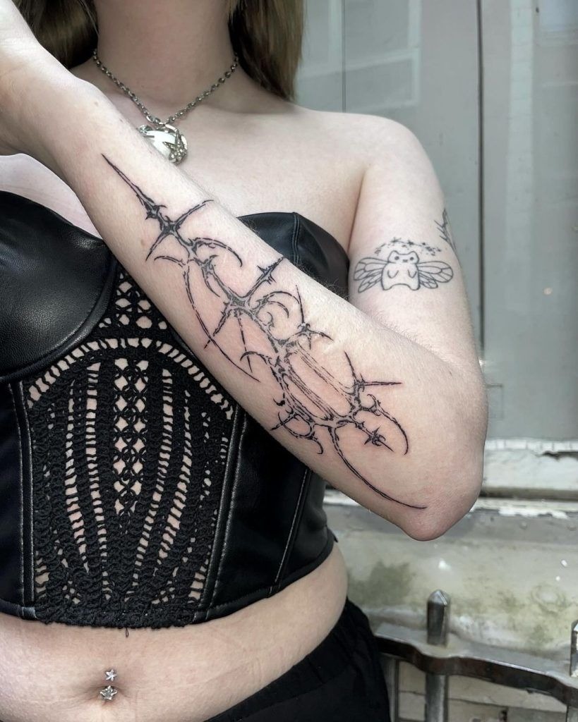 Spiked Gothic Circuitry on the Forearm Tattoo Design