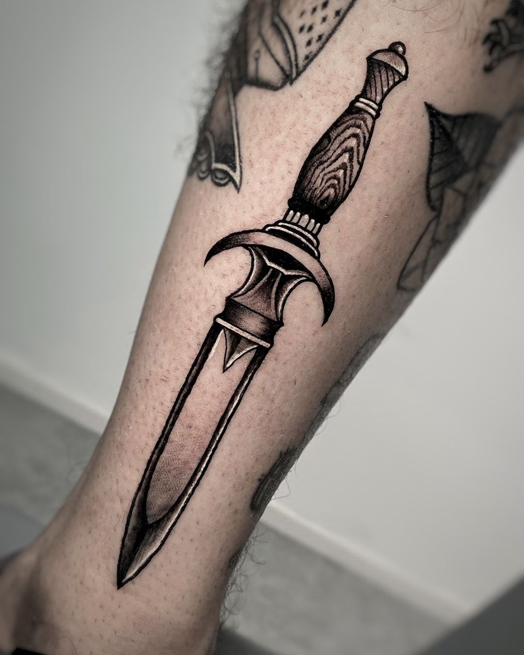 Bold Wood-Handle Dagger Tattoo Tattoo Design