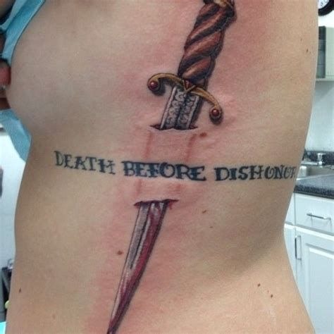 Script and Dagger Side Tattoo Tattoo Design