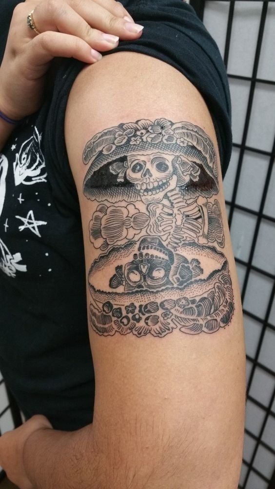 Classic Etching-Style Skeleton Scene On Upper Arm Tattoo Design