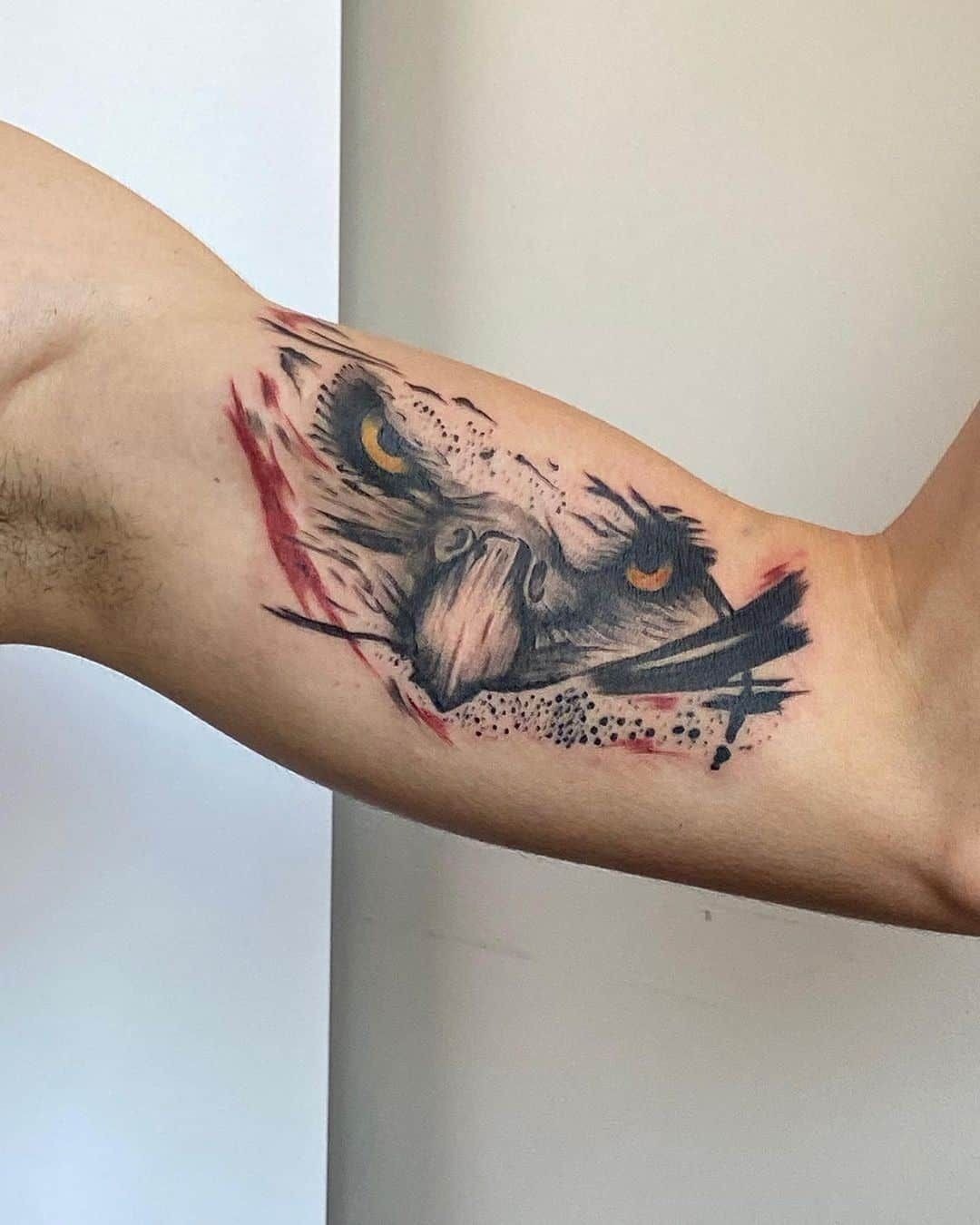 Abstract Eagle Face With Red Accents Tattoo Design