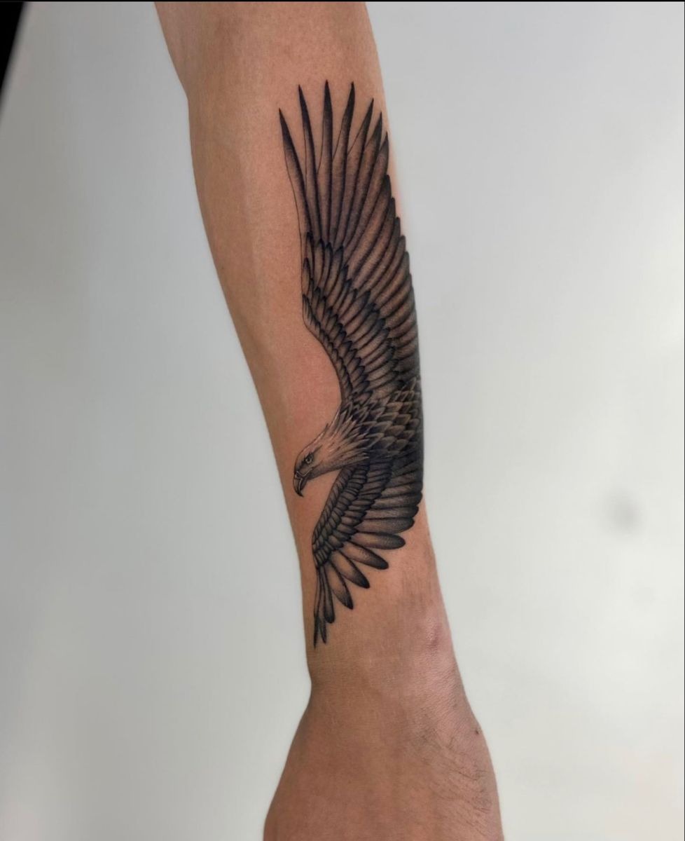 Long Eagle Along the Forearm Tattoo Design