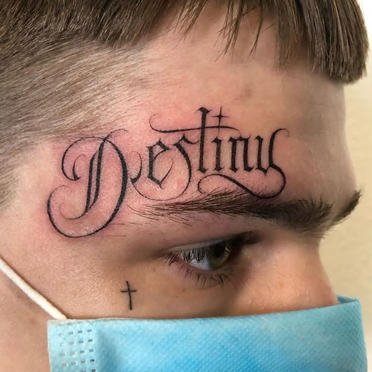 Forehead Destiny Script Tattoo Design