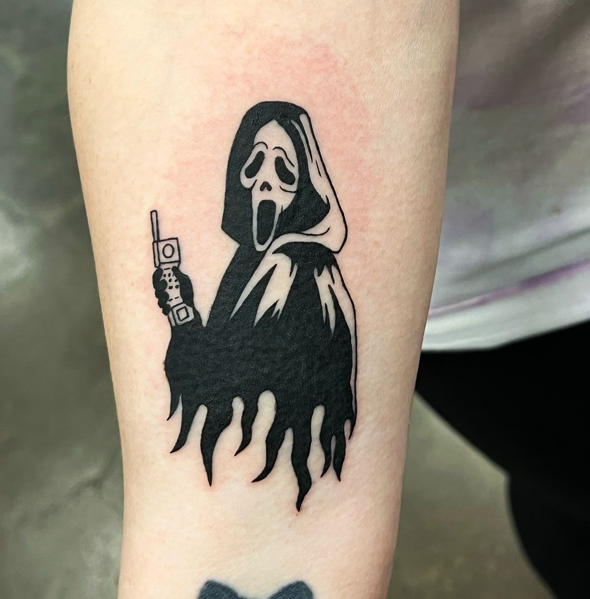 Simple Ghostface with Cell Phone Tattoo Design