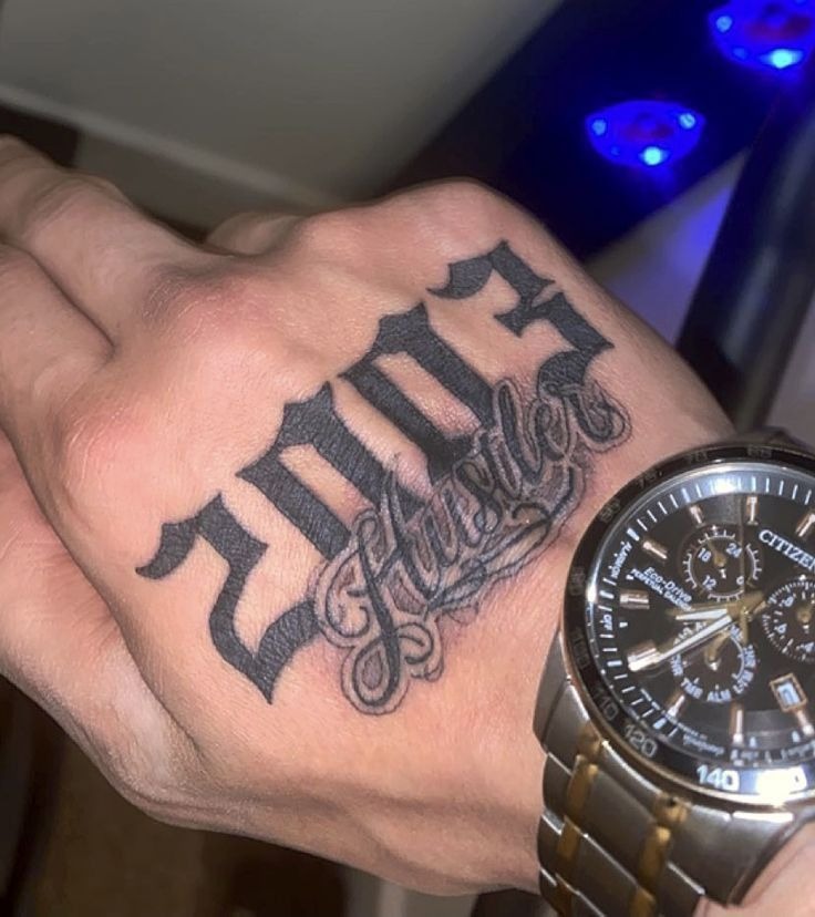 Bold Date and Script Hand Tattoo Tattoo Design