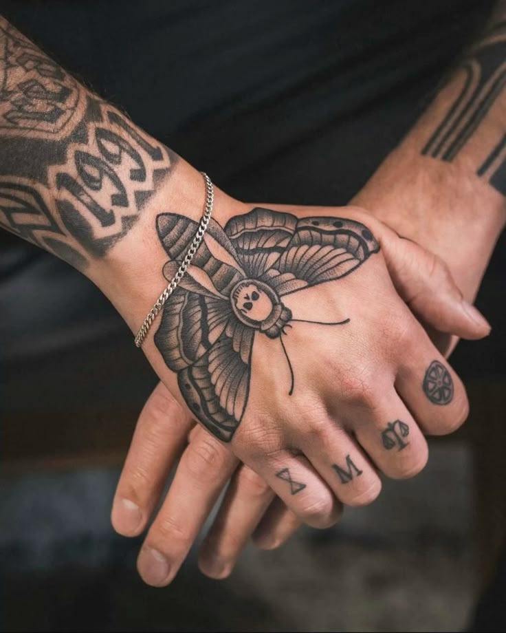 Butterfly Hand Tattoo with Fine Line Detail Tattoo Design