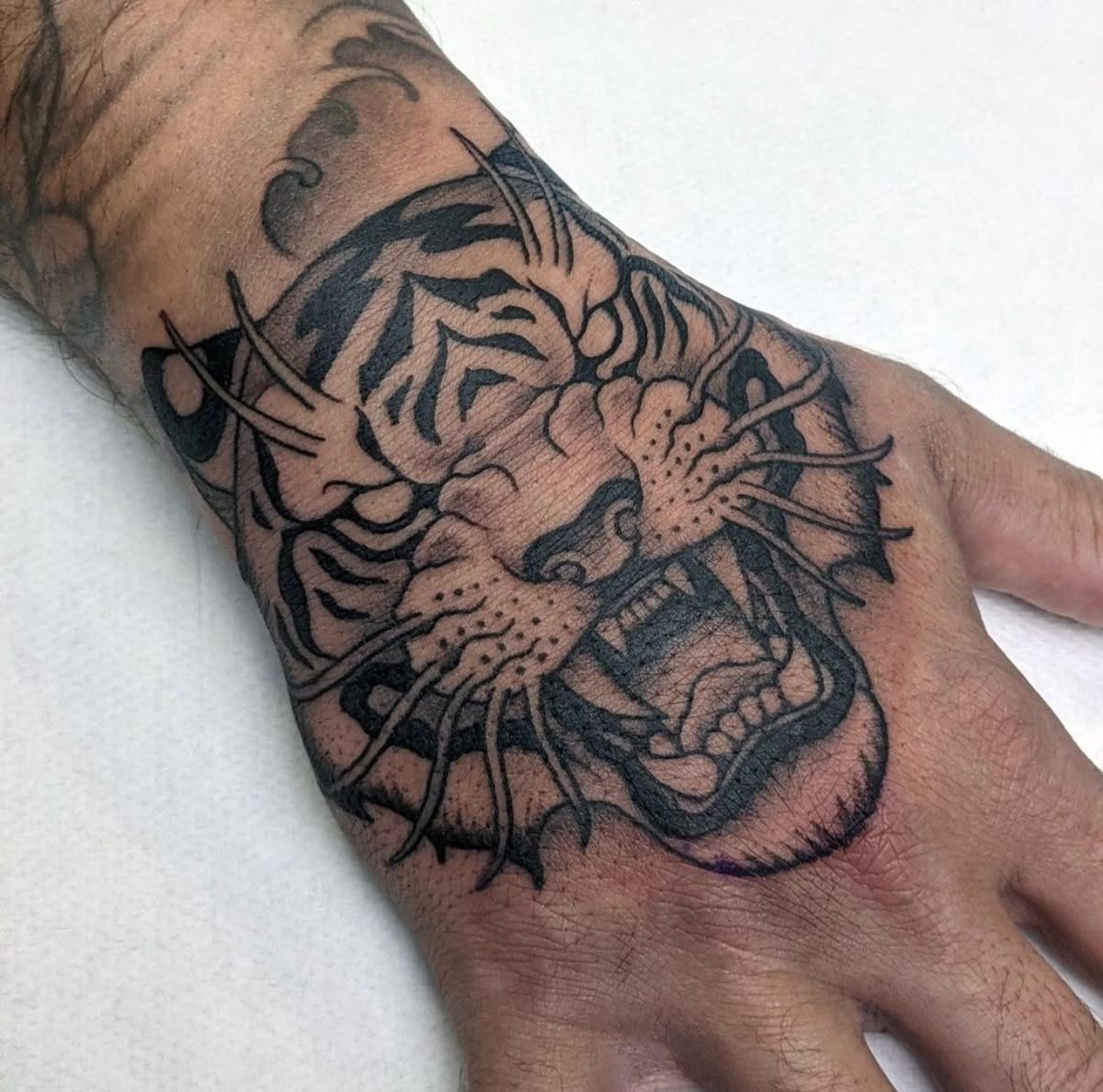Cross and Rose Hand Tattoo Tattoo Design