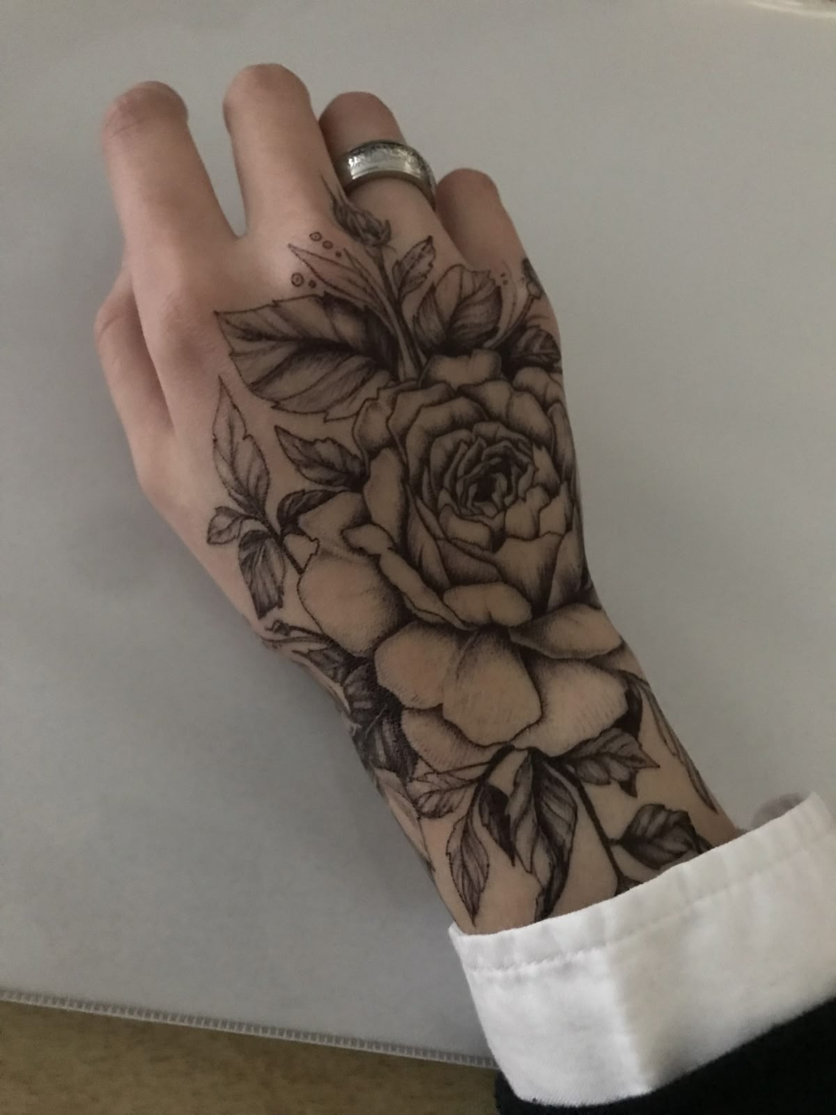 Fine Line Floral Hand Tattoo Tattoo Design