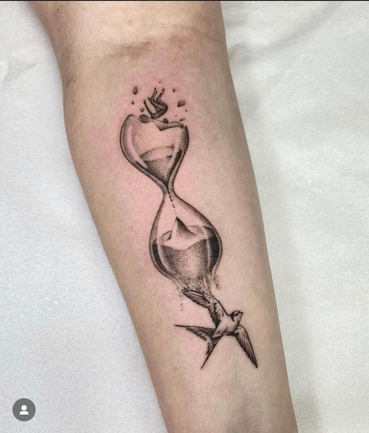 Hourglass with Bird in Flight Tattoo Design