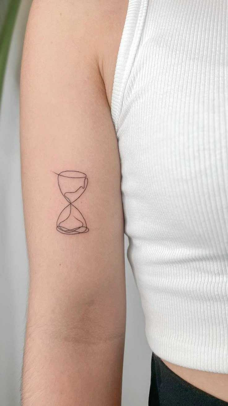 Tiny Minimal Hourglass Linework Tattoo Design