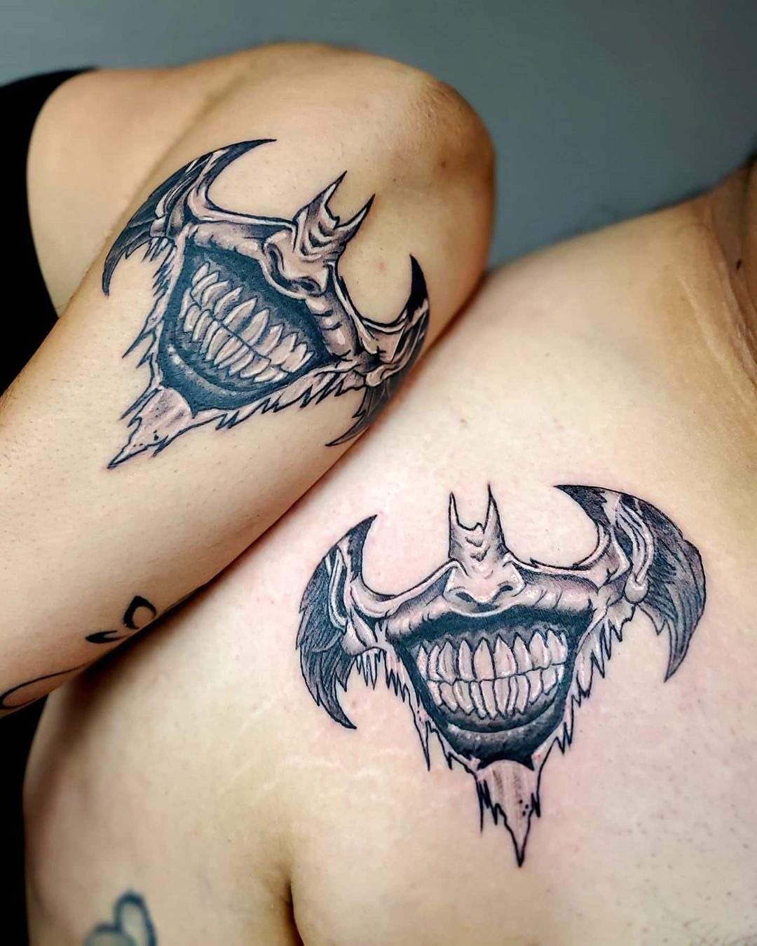 Matching Bat Smile Tattoos, a tattoo design rendered in bold.