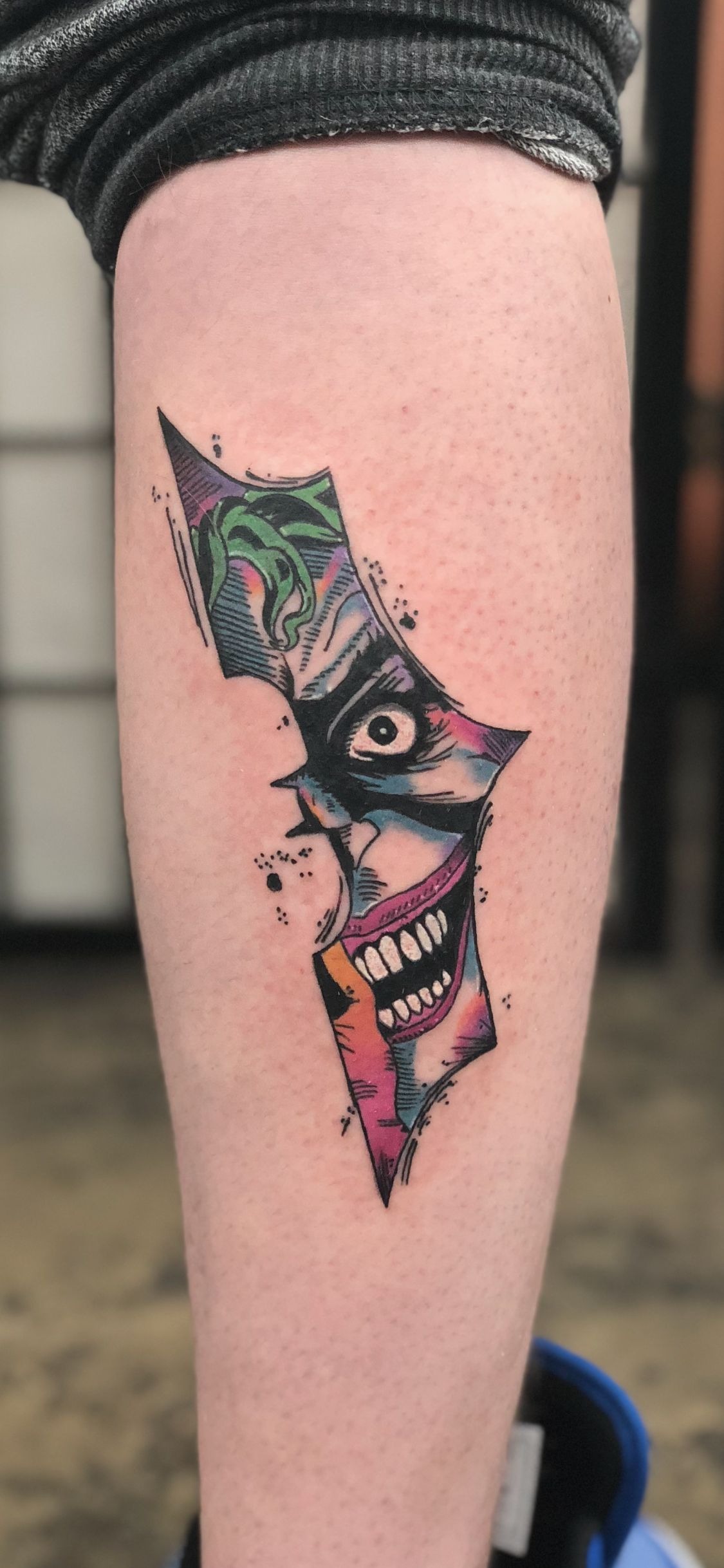 Torn Color Comic Shard, a tattoo design rendered in clean detailed linework.