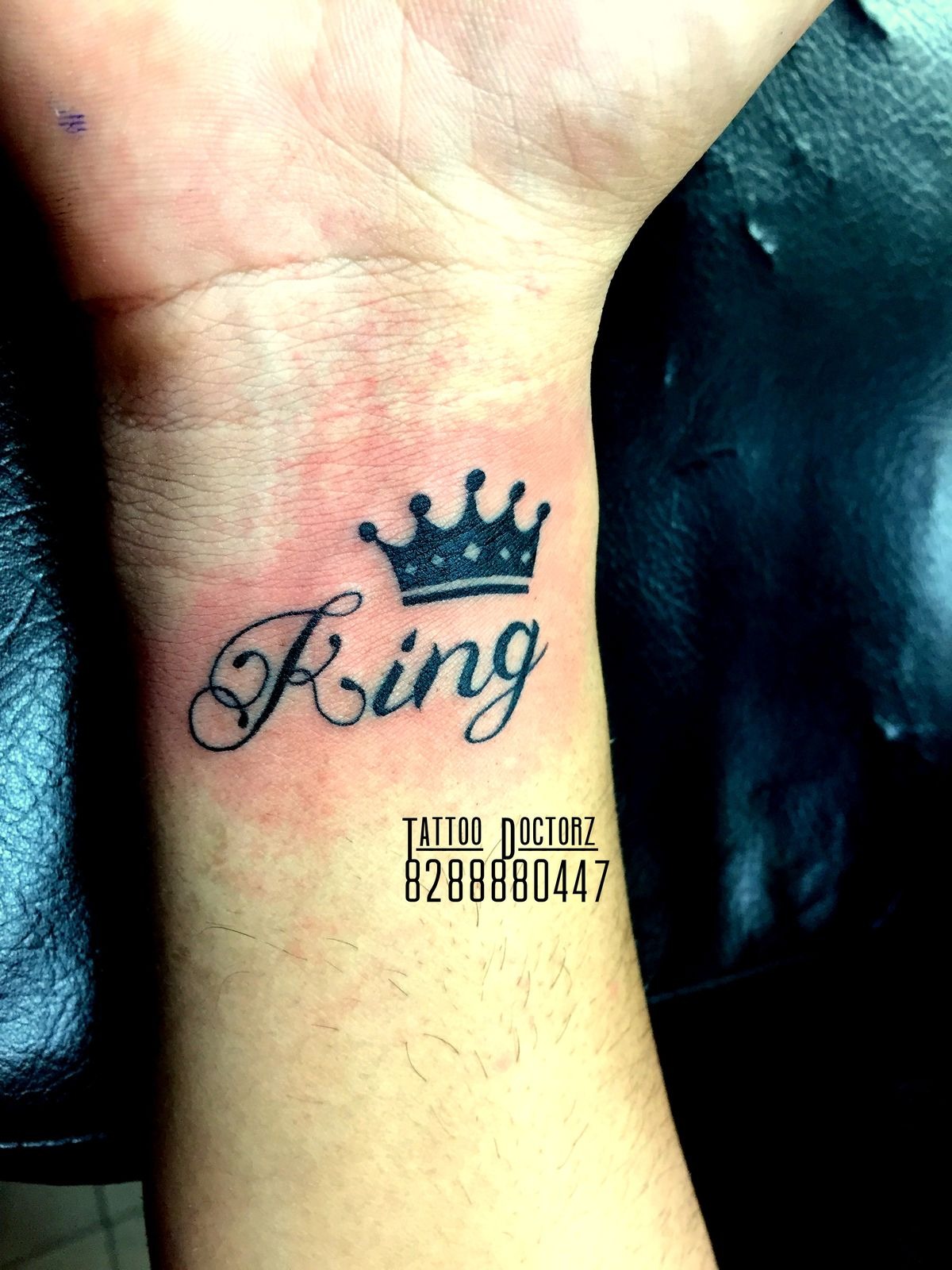 Small King Script Wrist Accent Tattoo Design
