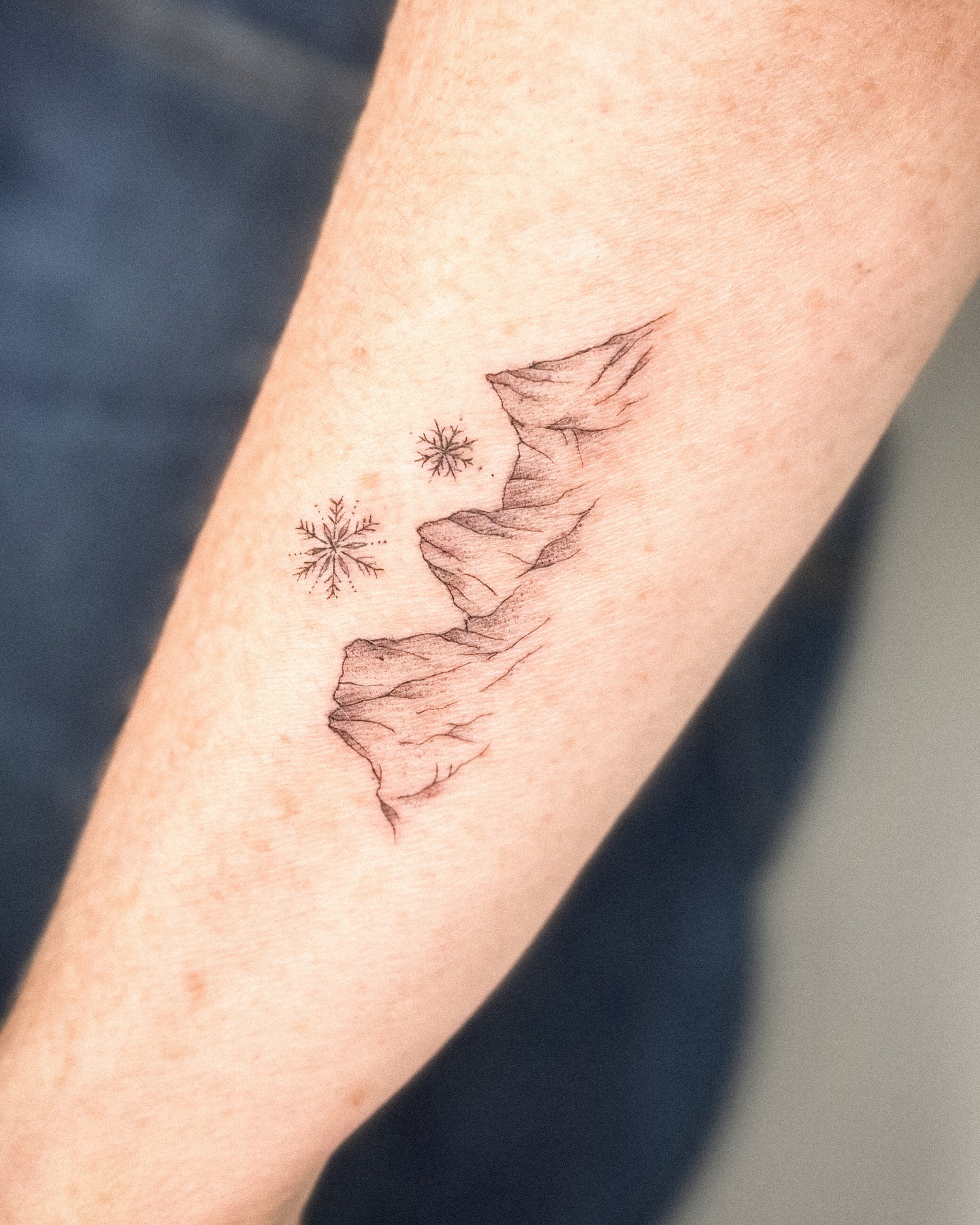 Minimal Mountain and Snowflake Tattoo Tattoo Design