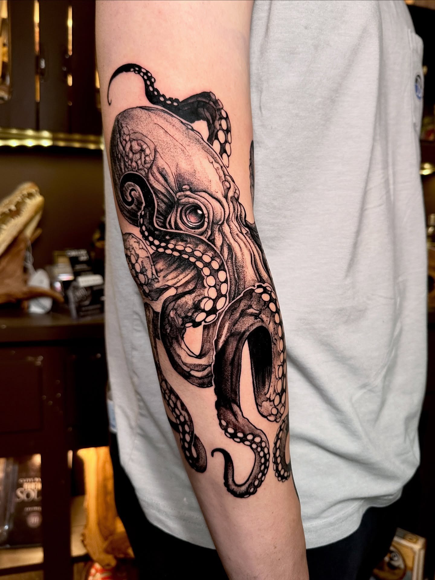 Forearm Octopus Tattoo with Bold Contrast Tattoo Design