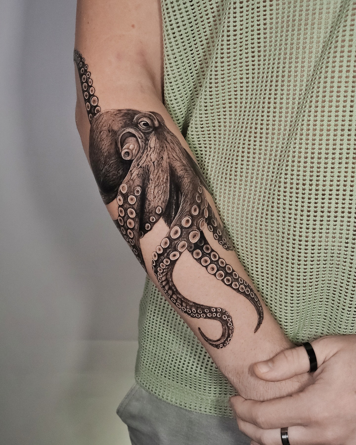 Forearm Octopus Tattoo with Realistic Detail Tattoo Design