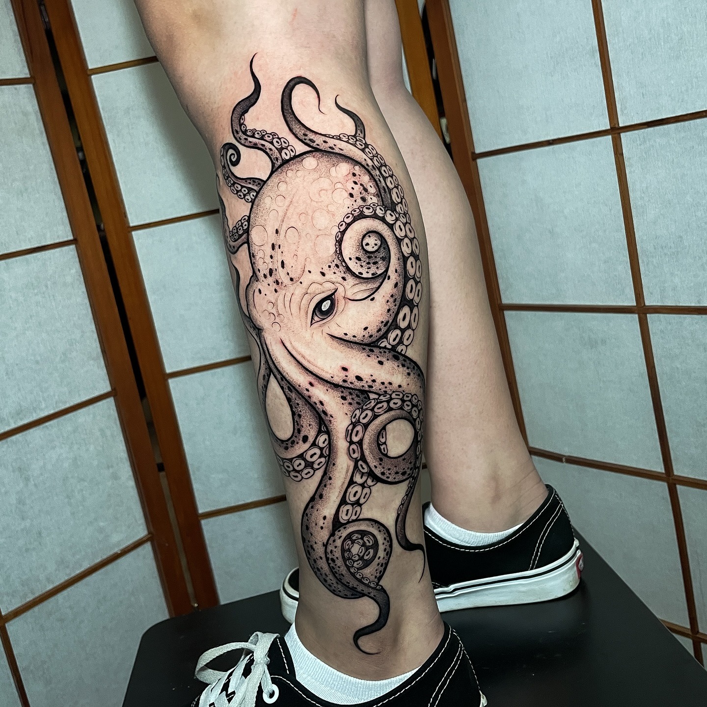 Octopus Calf Tattoo with Flowing Tentacles Tattoo Design