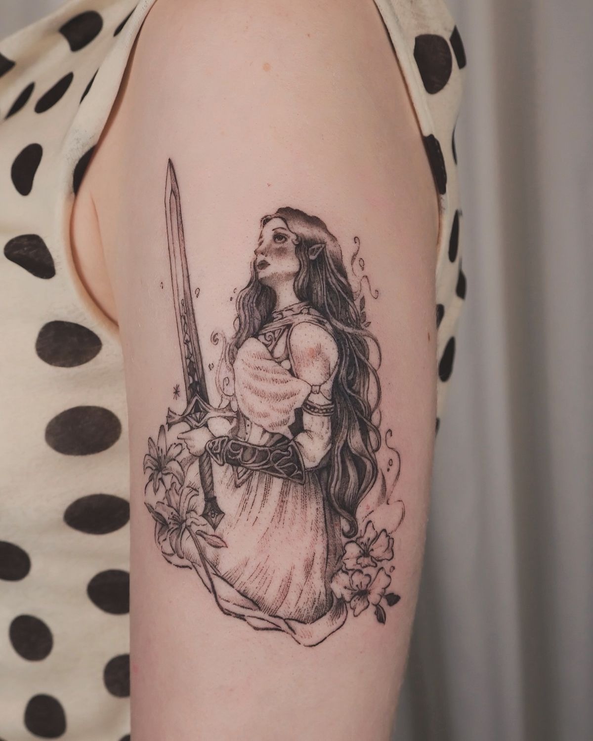 Angelic Warrior Lady Tattoo with Floral Details Tattoo Design