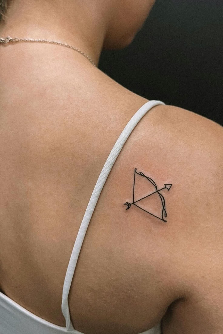 Sleek Shoulder Symbol Tattoo Design