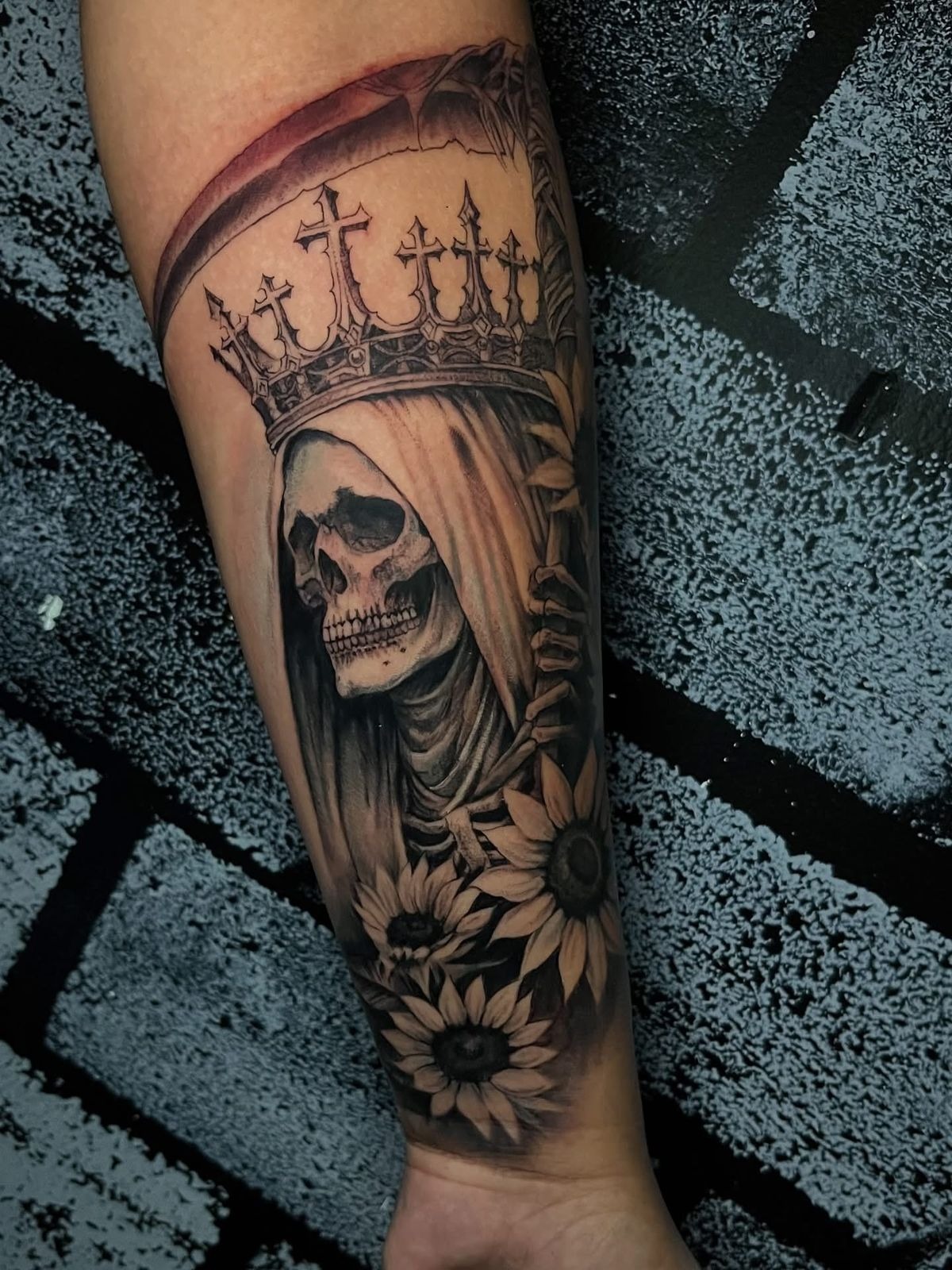 Crowned Santa Muerte Forearm Tattoo With Flowers, a tattoo design rendered in clean detailed linework.