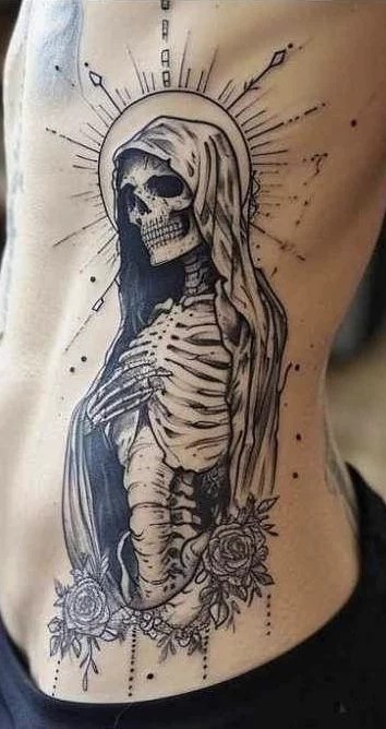 Fine Line Santa Muerte Rib Tattoo With Halo, a tattoo design rendered in sketch-style for the leg.