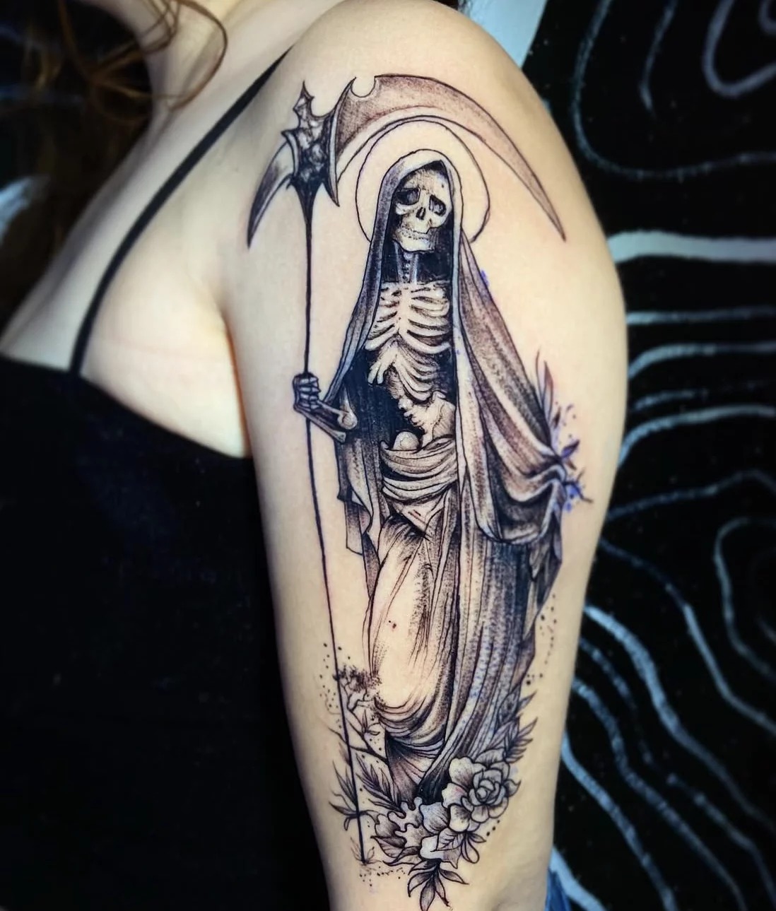 Fine Line Santa Muerte Shoulder Tattoo, a tattoo design rendered in clean detailed linework.