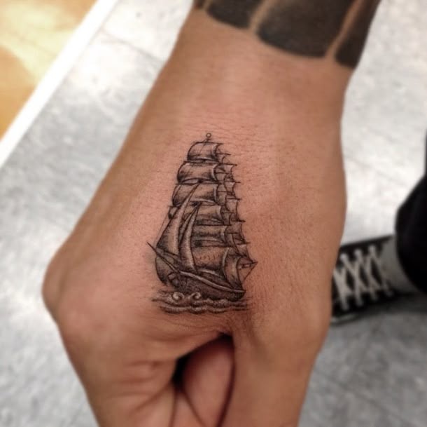Small Traditional Hand Ship Tattoo Tattoo Design