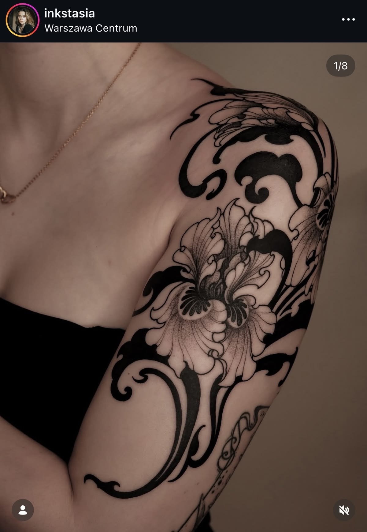 Blackwork Iris Shoulder Tattoo, a tattoo design rendered in fine-line for the upper arm.