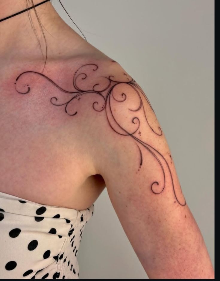 Delicate Ornamental Swirl Shoulder Tattoo, a tattoo design rendered in delicate fine-line for the upper arm.