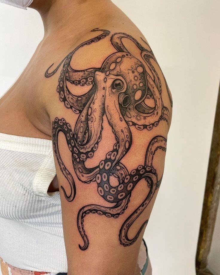 Detailed Octopus Shoulder and Upper Arm Tattoo, a tattoo design rendered in bold traditional.