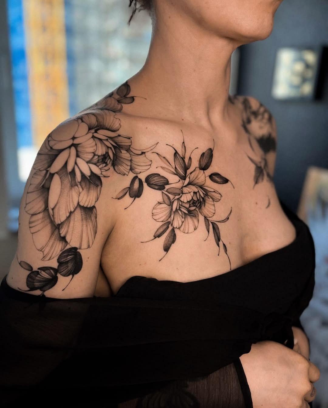 Elegant Black Floral Shoulder and Chest Tattoo, a tattoo design rendered in fine-line.