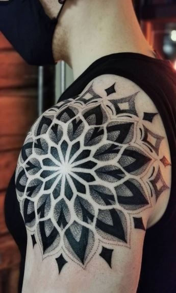 Geometric Blackwork Mandala Shoulder Tattoo, a tattoo design rendered in bold traditional.