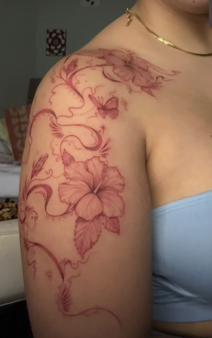 Red Floral and Butterfly Shoulder Tattoo, a tattoo design rendered in blackwork for the upper arm.