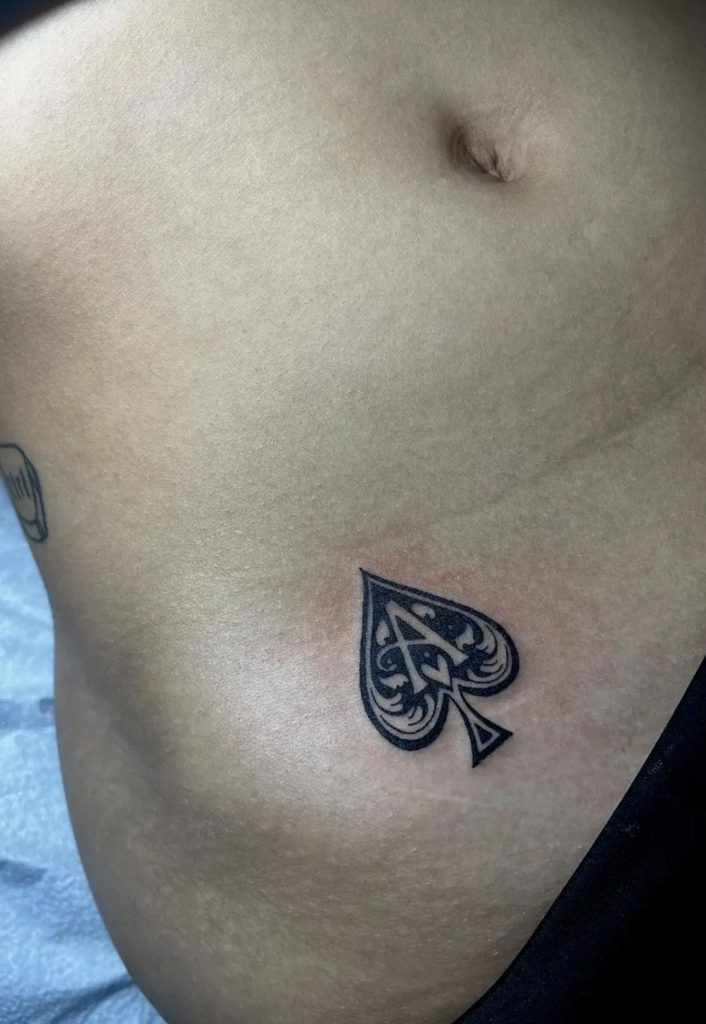 Bold Multi-Suit Spade Fusion Tattoo Design