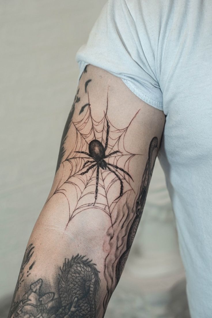 Botanical Black Spider With Soft Leaves Tattoo Design