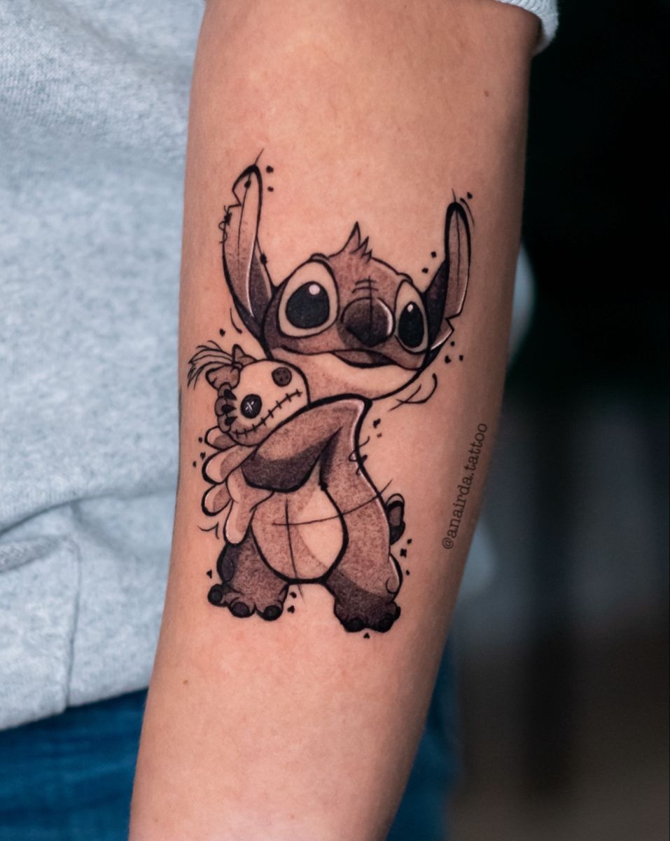 Black and Grey Stitch with Doll Detail, a tattoo design rendered in clean detailed linework.