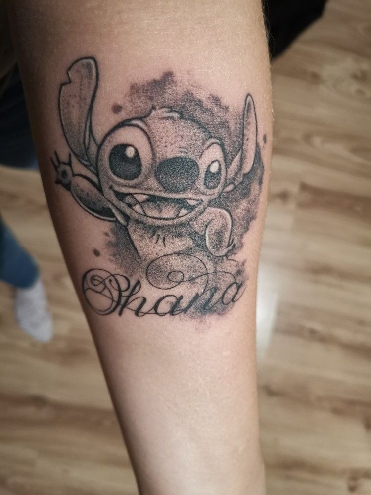Shaded Stitch with Script Name Detail, a tattoo design rendered in clean detailed linework for the leg.