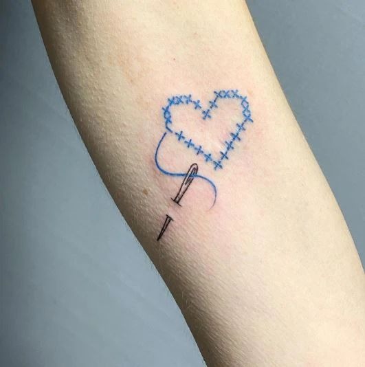 Stitched Heart and Needle Design, a tattoo design rendered in clean detailed linework for the back.