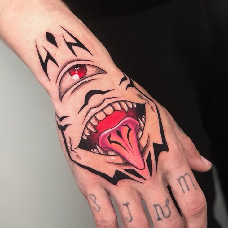 Bold Hand Design with Tongue and Eye Tattoo Design