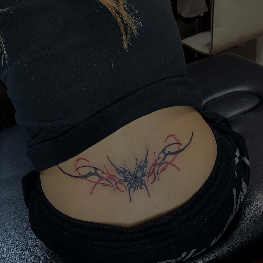 Delicate Floral Linework Lower Back Tattoo Tattoo Design