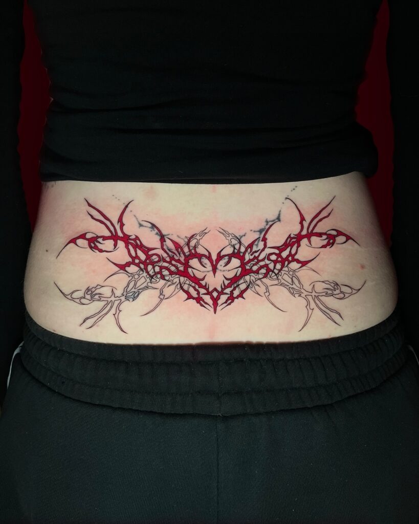 Red and Black Tribal Heart Lower Back Tattoo Tattoo Design