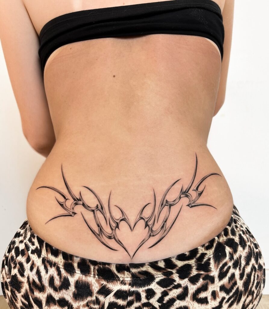Shaded Tribal Heart Lower Back Tattoo Tattoo Design