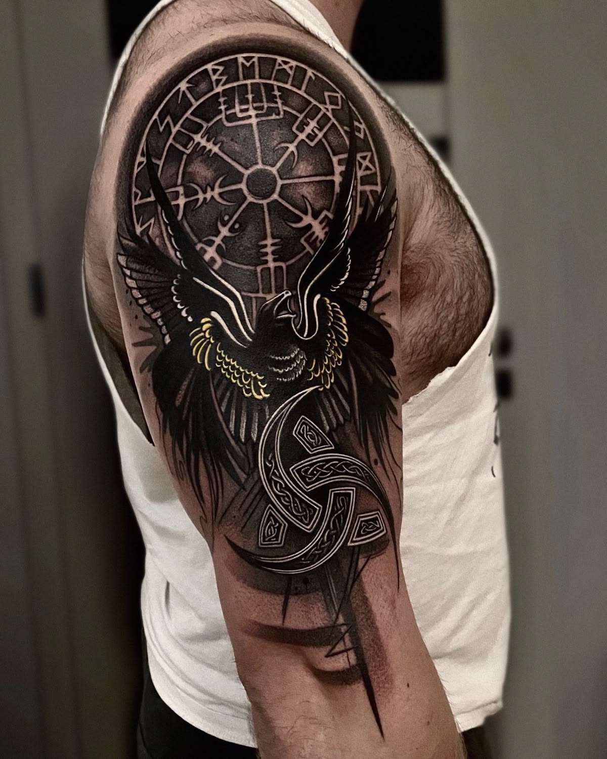 Raven and Compass Shoulder Shield Tattoo Design