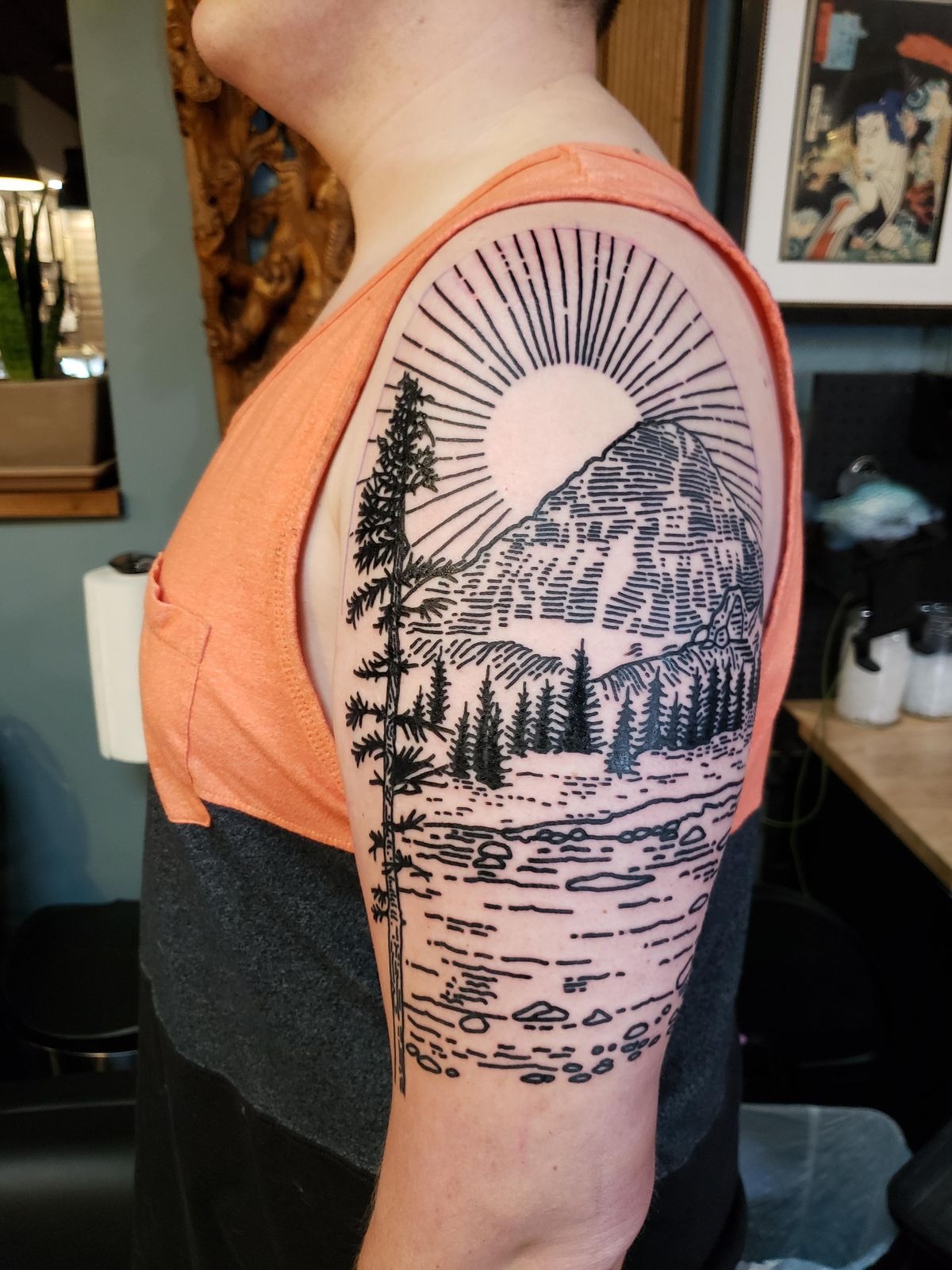 Mountain Landscape with Radiating Sun Lines Tattoo Design