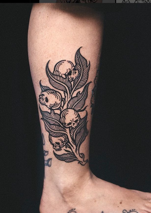 Skull-Bloom Botanical Branch Tattoo Design